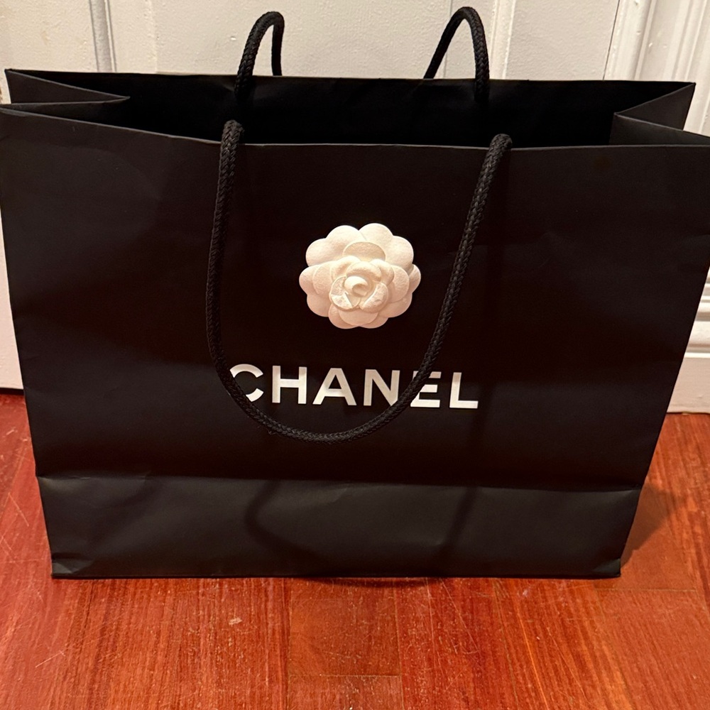 CHANEL Black Shopping Bag with White Flower Accent